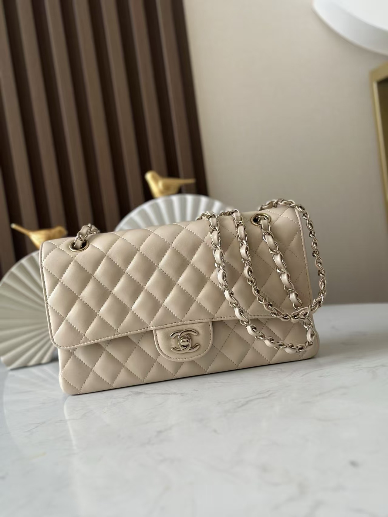 Chanel Classic Flap Bag Pearlescent apricot-colored lambskin with light gold hardware 15x25.5x6cm