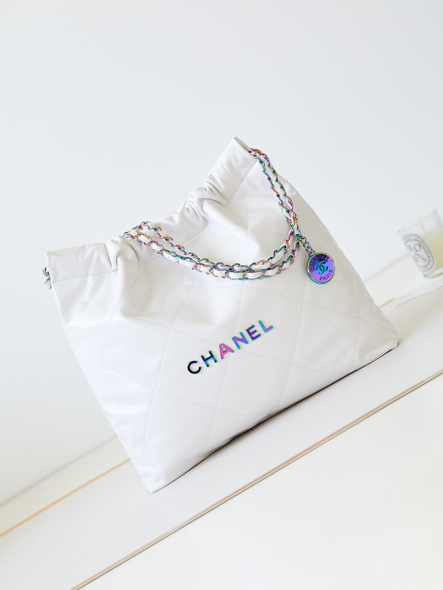 CHANEL 22 SMALL HANDBAG Shiny Calfskin Rainbow Metal White 15.21*16.38*3.12 in