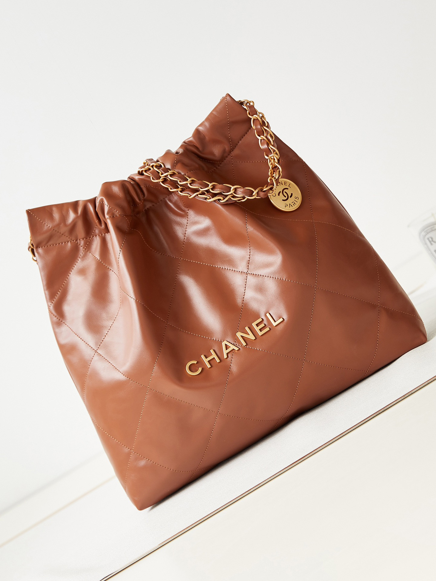 CHANEL 22 SMALL HANDBAG Shiny Calfskin BROWN 13.7*14.4*2.7 in