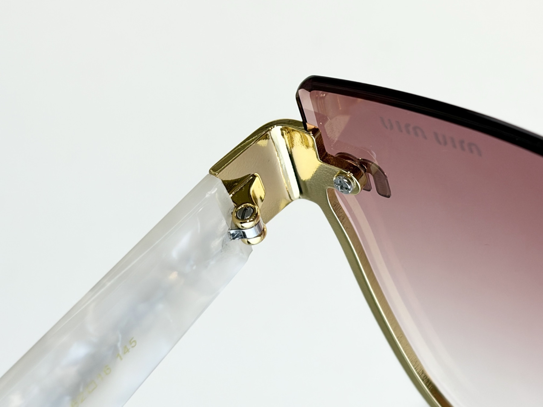 Miu Miu Glasses MU 70ZS 62-16-145 - Image 10