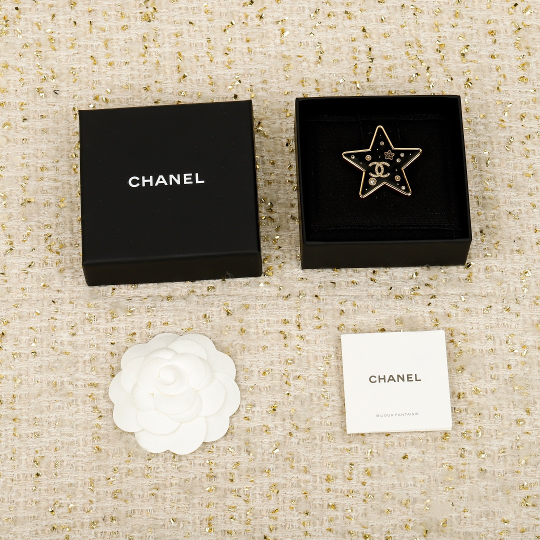 Chanel Gold and Black Five-Pointed Star Brooches